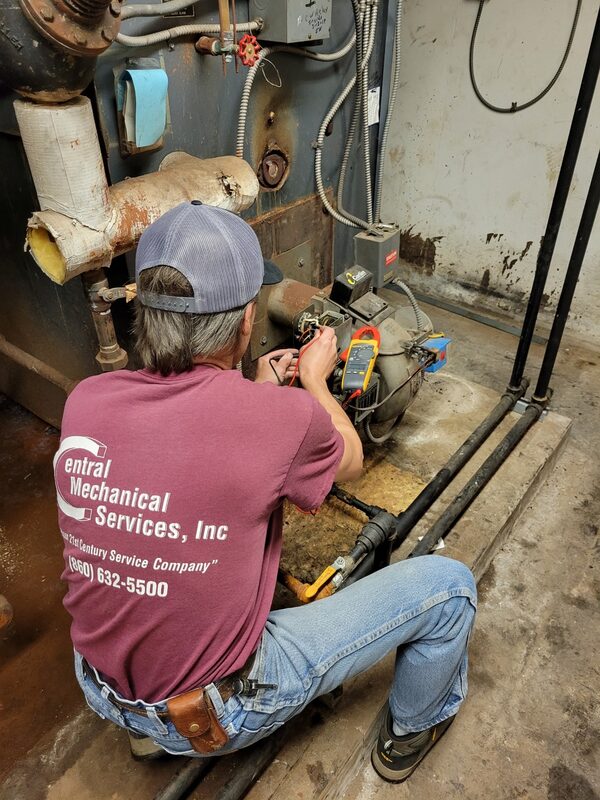 Central Mechanical employee performing preventative maintenance